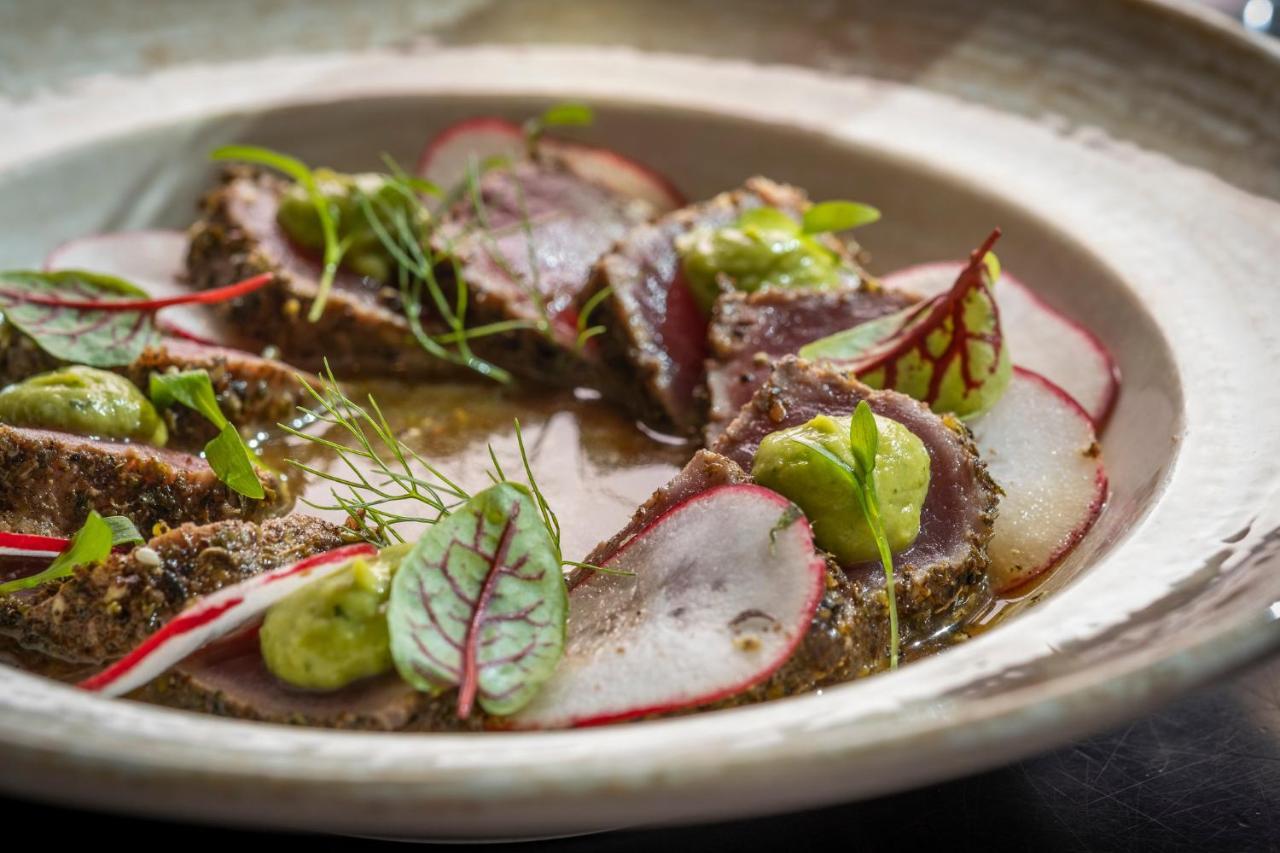 Kimpton Epic Hotel By Ihg Miami Bagian luar foto A dish of cured and smoked fish